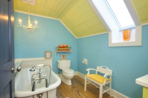 A claw-foot tub and chandelier came with the home when the Stokes moved in. Photo courtesy of Yost and Yost, Intracoastal Realty, Inc. 