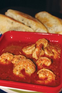 Voodoo shrimp are served in a broth of butter, beer and spices, paired with French bread toast points. 