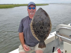 Captain Alan Beasley nabbed this flounder in late July. He says the loads of rainfall we've had this summer have caused the fish to move to places they wouldn't be found earlier this year. Courtesy photo