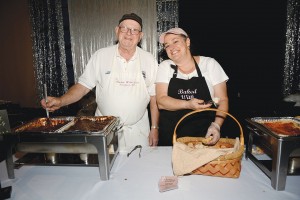 Staff from Southport's Baked with Love (owner Lisa Botnick on right) serve up gourmet meals at a past Taste of Brunswick County event. Courtesy photo