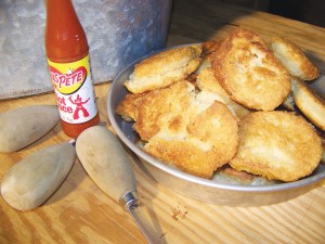 Homemade cornbread and hot sauce are quintessential fixin's for a Southern oyster roast. Photo by Amber Lanier