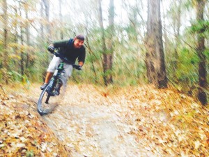 Gene Areno mountain bikes in the trails of Brunswick Nature Park, and along with dietary changes, it's helped him lose 38 pounds so far. Courtesy photo