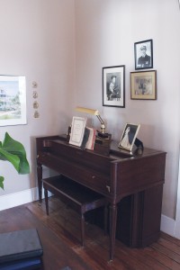 The piano in the den belonged to Miss Mary, the owner's grandmother. Bridal portraits of the owner, Meezie Childs, and her mother, Lois Jane, rest upon the instrument. Photo by Bethany Turner