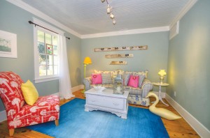 The first seating area, directly left of the foyer. Photo courtesy of Yost and Yost, Intracoastal Realty, Inc. 