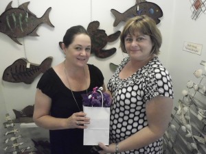 Laurie Driver (owner of Magnolia Gifts and Antiques) and Pam Reade, winner of $180 gift certificate raffle. Courtesy photo