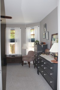 The master bedroom offers a bay window, through which billowing breezes blow. Photo by Bethany Turner