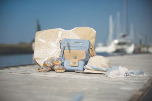 Messenger Bag by Noelle, $39.98; Wallet by Noelle, $24.98; Sandals by Noelle, $34.98; Beach bag by Mud Pie, $18.98; all from Deborah's Place.