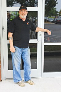 Noah Goldman, CEO and brewmaster of Check Six Brewing Company, stands in front of the door of what will be Southport's first local brewery, located at 5130 Southport-Supply Road SE. 