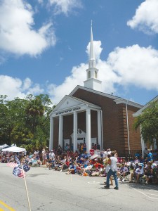 Spectators view the 2013 NC 4th of July Festival parade along Howe Street outside of the Southport Baptist Church. Photo by Bethany Turner