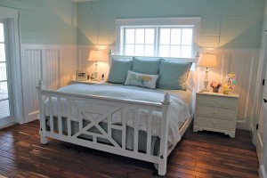 The bedrooms and bathrooms all feature their own trims and finishes, creating a separate personality for each space.  Photo by Bethany Turner