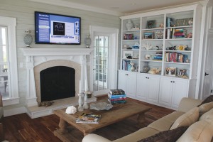 Faux wood-plank painting in gray-green shades adds coastal charm to indoor spaces. Photo by Bethany Turner