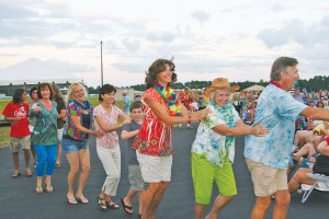 Folks dance the conga line during last year's Phlock to the Beach outdoor concert. Courtesy photo