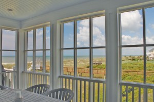 The screened porch uses screen that is very fine, so that it appears like a plane of glass. Photo by Bethany Turner