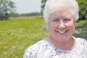 June Beasley, Southport's resident 'veggie snob,' stands in the fields of the family farm she grew up on in Loris, South Carolina. Photo by Kris Beasley