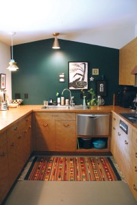 The kitchen features 1950s cabinets she located in Missouri. Photo by Bethany Turner