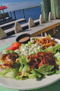 The Southport Salad: fresh Romaine, Gorgonzola crumbles, fried onions, roasted garlic, tomato wedges, and smoked bacon with balsamic vinaigrette. Photo by Bethany Turner