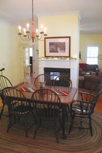 Dining room with freestanding fireplace. Photo by Bethany Turner