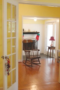 The home's original fireplace awaits in the den. Photo by Bethany Turner