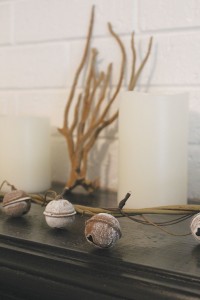 Though the original fireplace is not currently functional, the mantel offers a sweet space for seaside decor. Photo by Bethany Turner