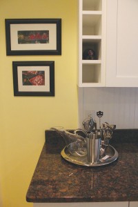 The kitchen's custom cabinetry offers space for wine bottles. Photo by Bethany Turner